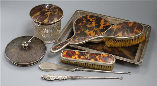 A matched silver-mounted tortoiseshell dressing table set,